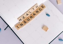 health insurance scrabble tiles on planner